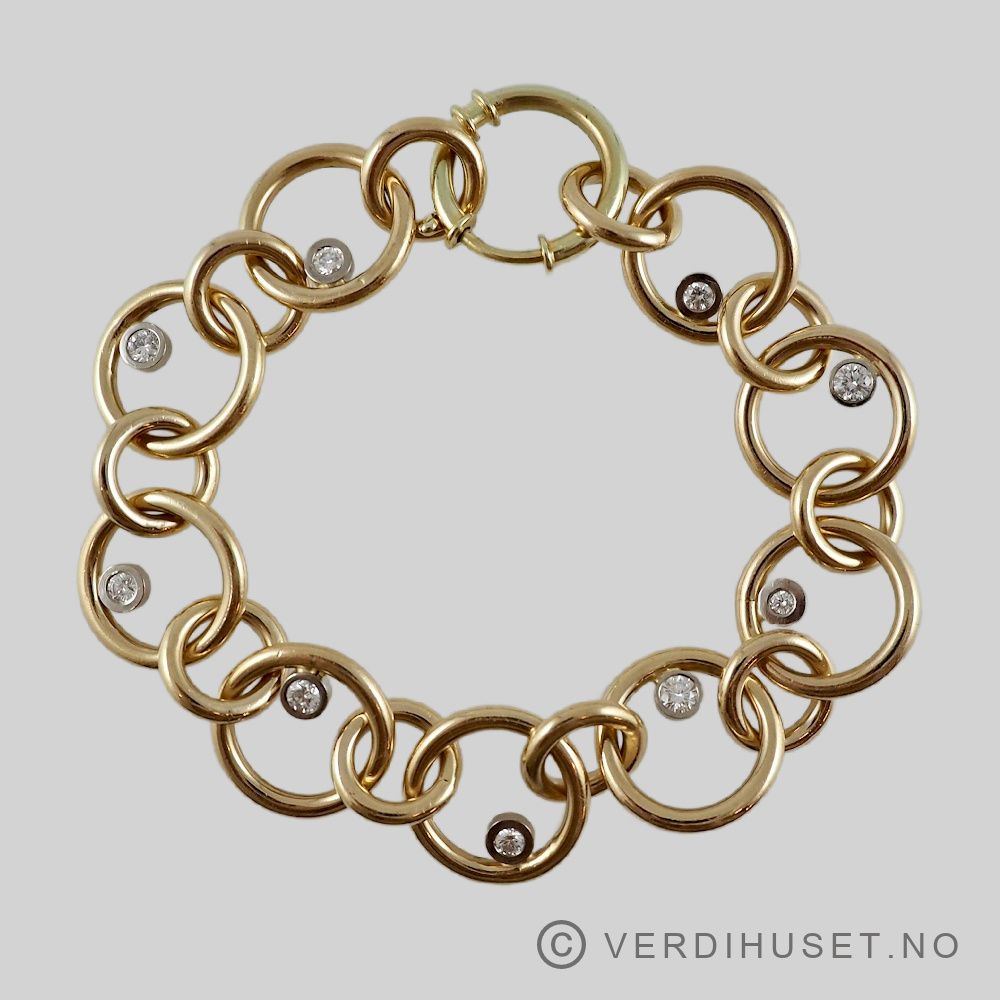 Armbånd i 14 K hvitt og gult gull med 9 diamanter