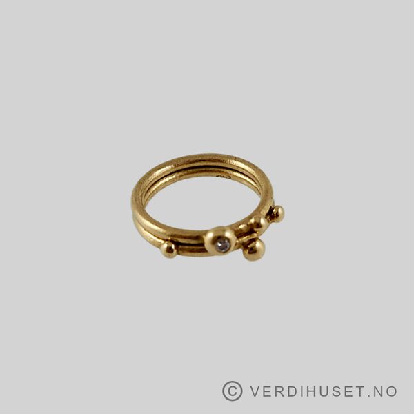 Hovedbilde 2 ringer i 18 K gull med 1 blank sten