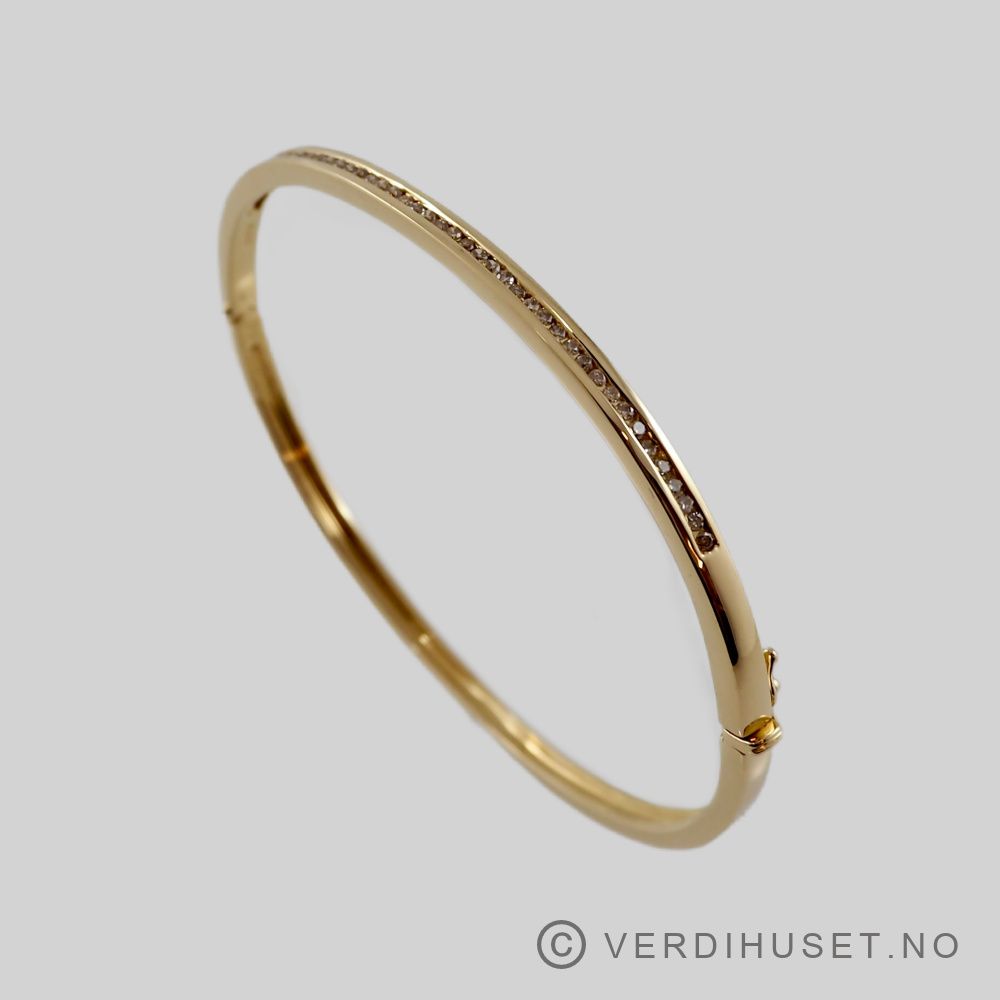 Armring i 18 K gull med blanke stener